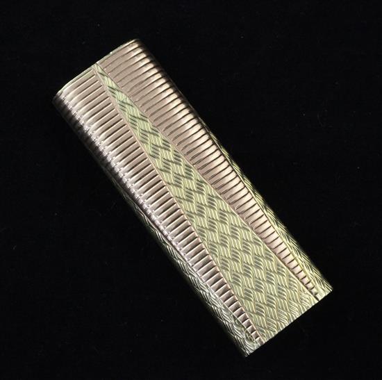 A Cartier two colour gold plated lighter, 2.75in.